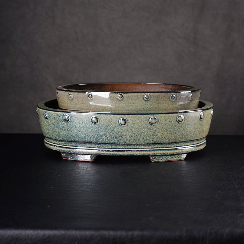 Does the handmade, hand-tapped purple clay glaze basin production process ensure that each piece has a unique shape, natural texture, and a smooth, refined feel?