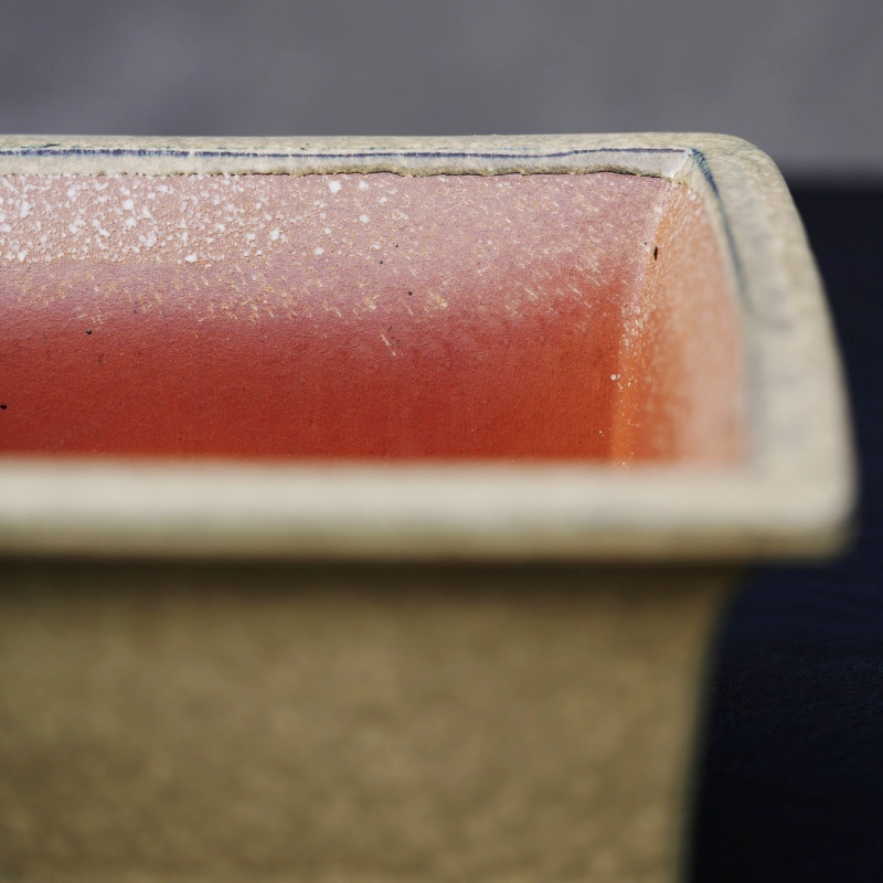 How is the glaze crackle effect of the purple sand ceramic glaze flower pot formed during firing?