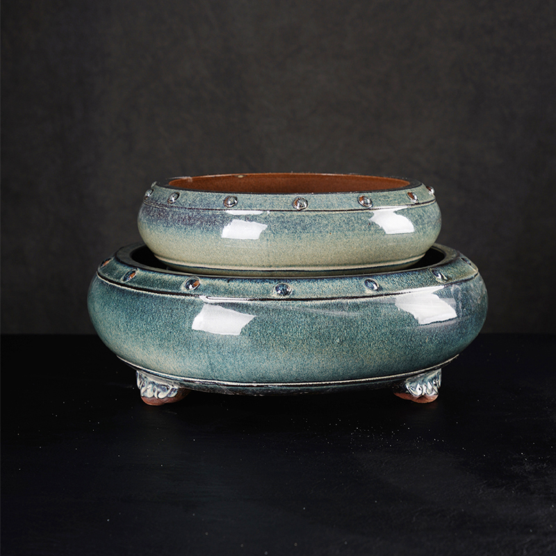 How does the classic purple sand glaze flower pot achieve a unity of beauty, practicality, and plant health through handcrafted purple clay and glazing techniques?